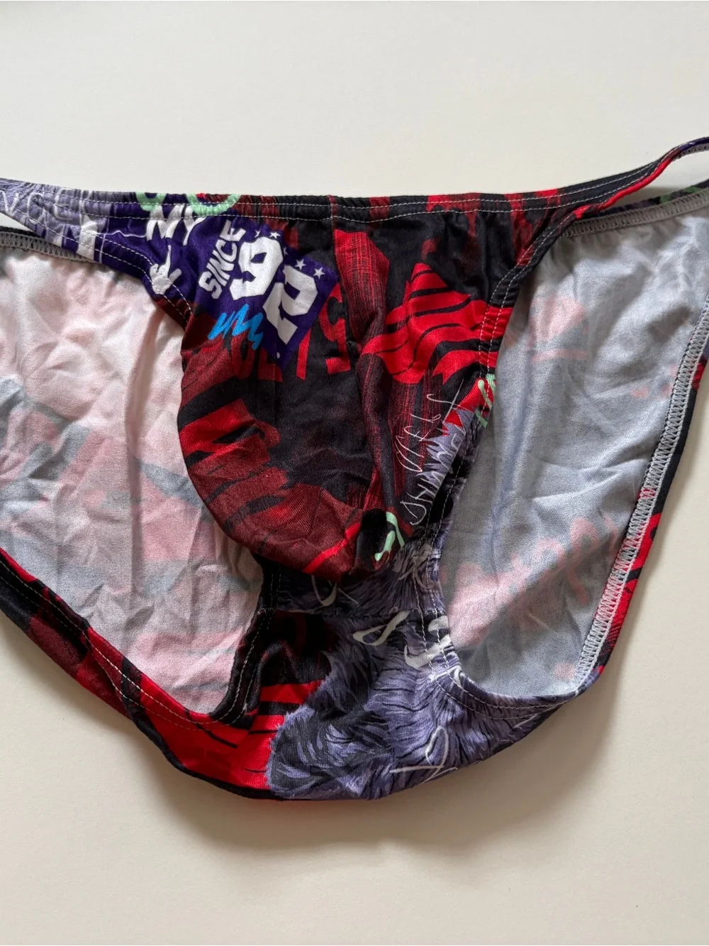 Men's Graphic Bikini Briefs with Bold Red & Black Print